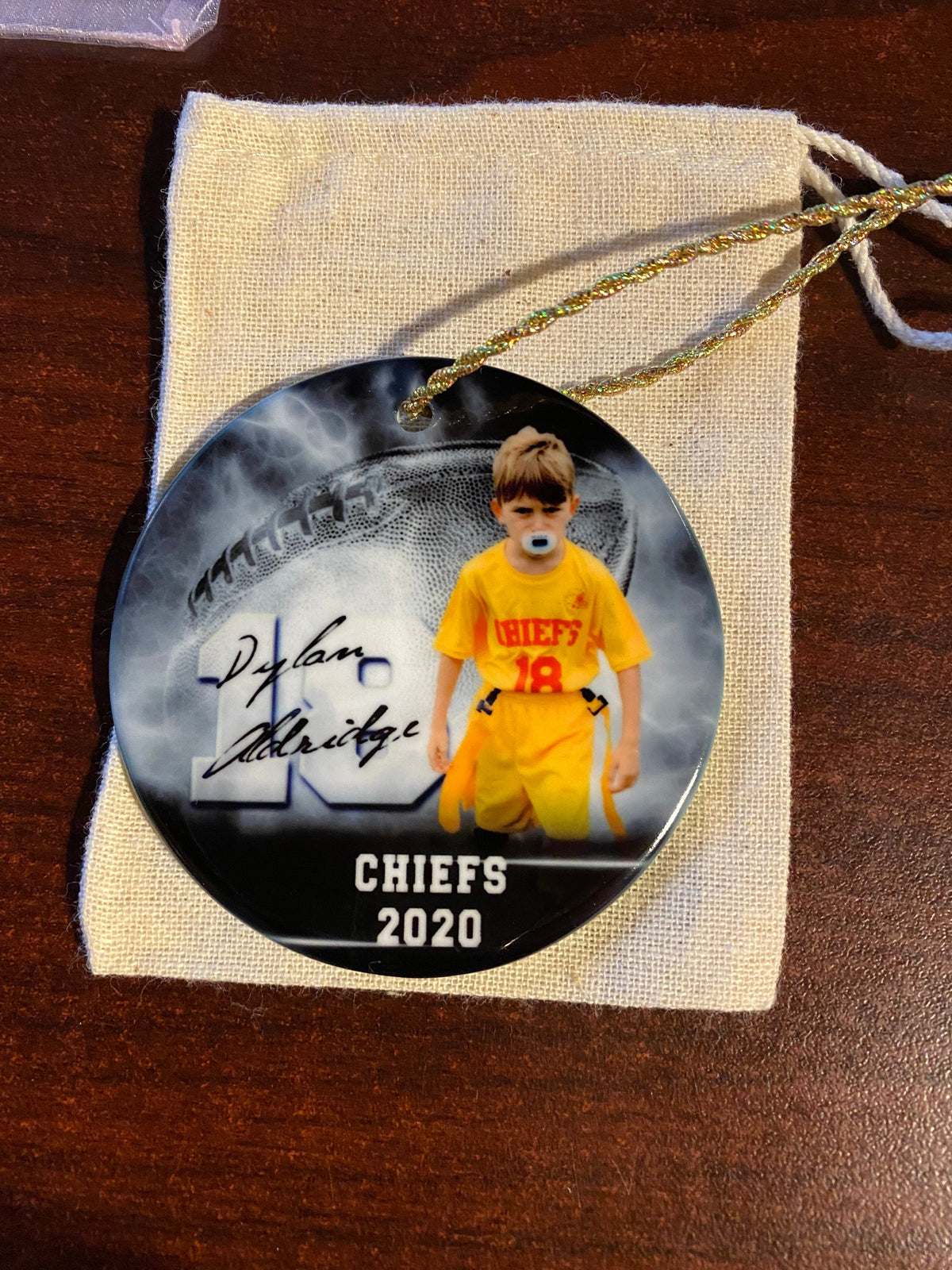 Customized football ornament. Great for senior who committed or for teams end of season gift. Can be personalized with 2 different picture.