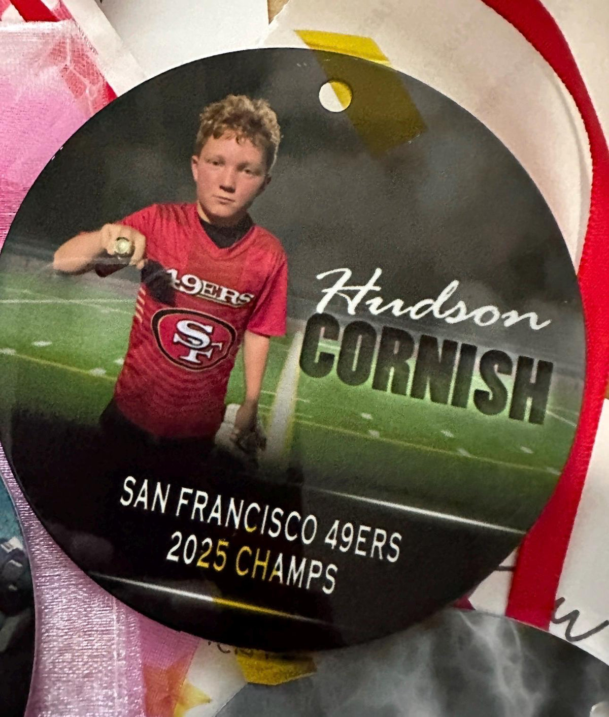Customized football ornament. Great for senior who committed or for teams end of season gift. Can be personalized with 2 different picture.